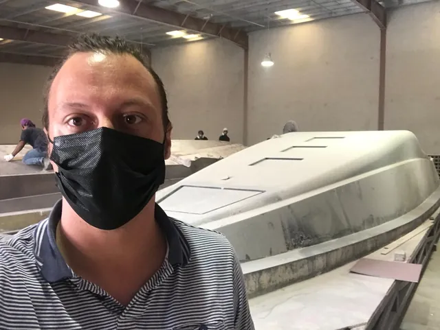 Igor in the composites workshop beside the Mayla 44 GT hull