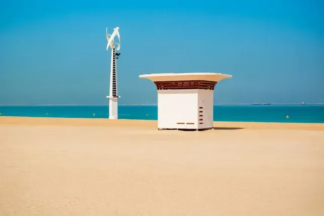 A pole beside one of the beach kiosks