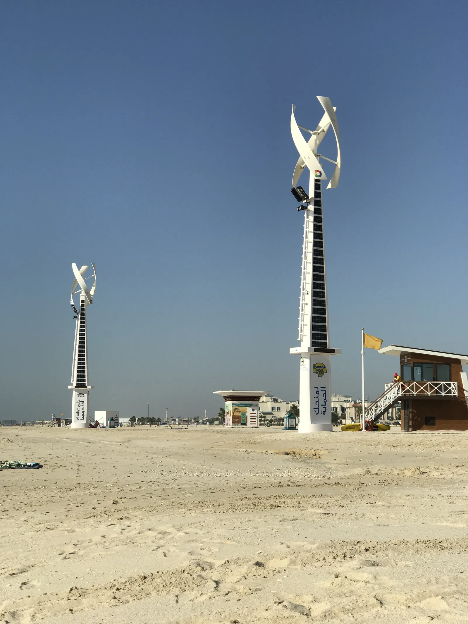 Two poles marking the run of the beach
