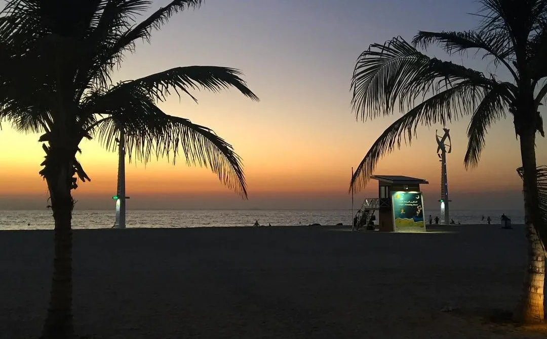 Sunset at Kite Beach, the poles lit